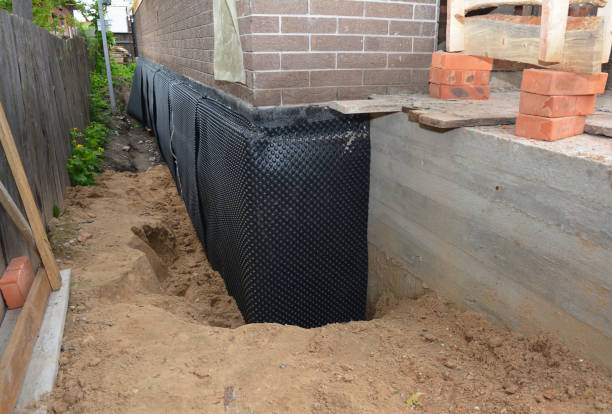 Happy homeowners after waterproofing job in Conshohocken